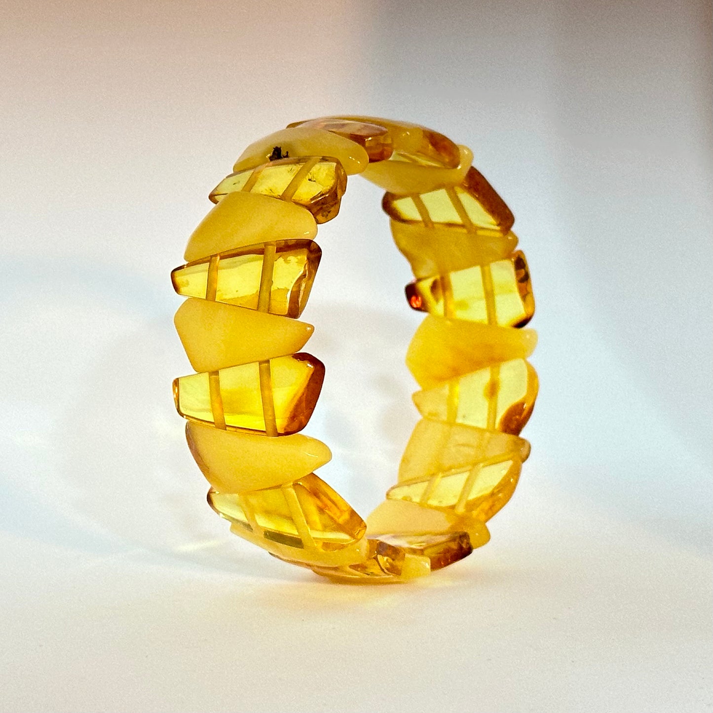 White and transparent triangle amber bracelet