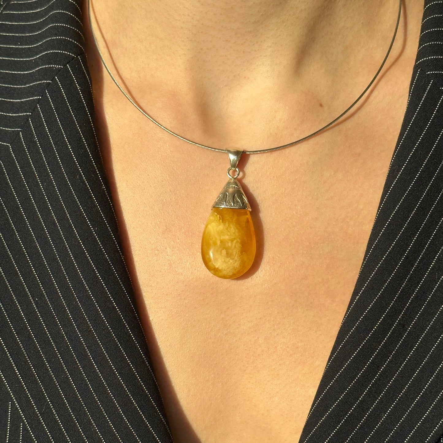 Sunburst-inspired amber pendant