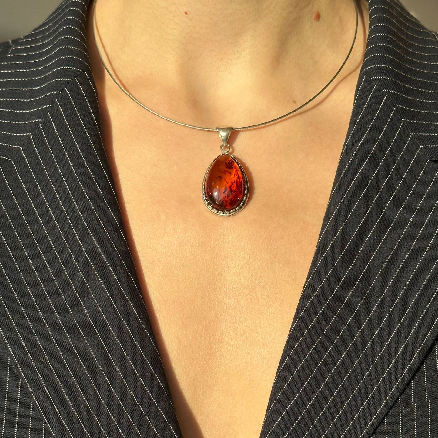 Fiery brown amber pendant