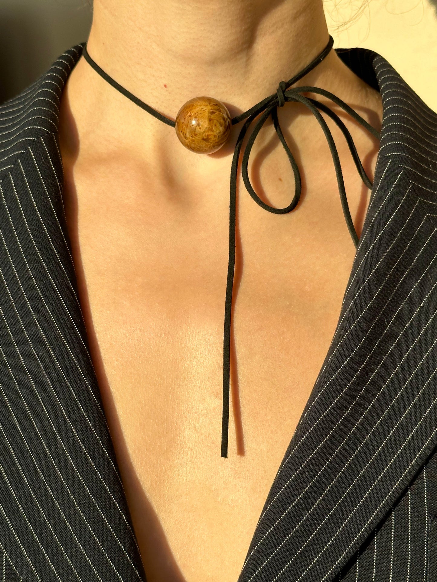 Versatile round amber pendant