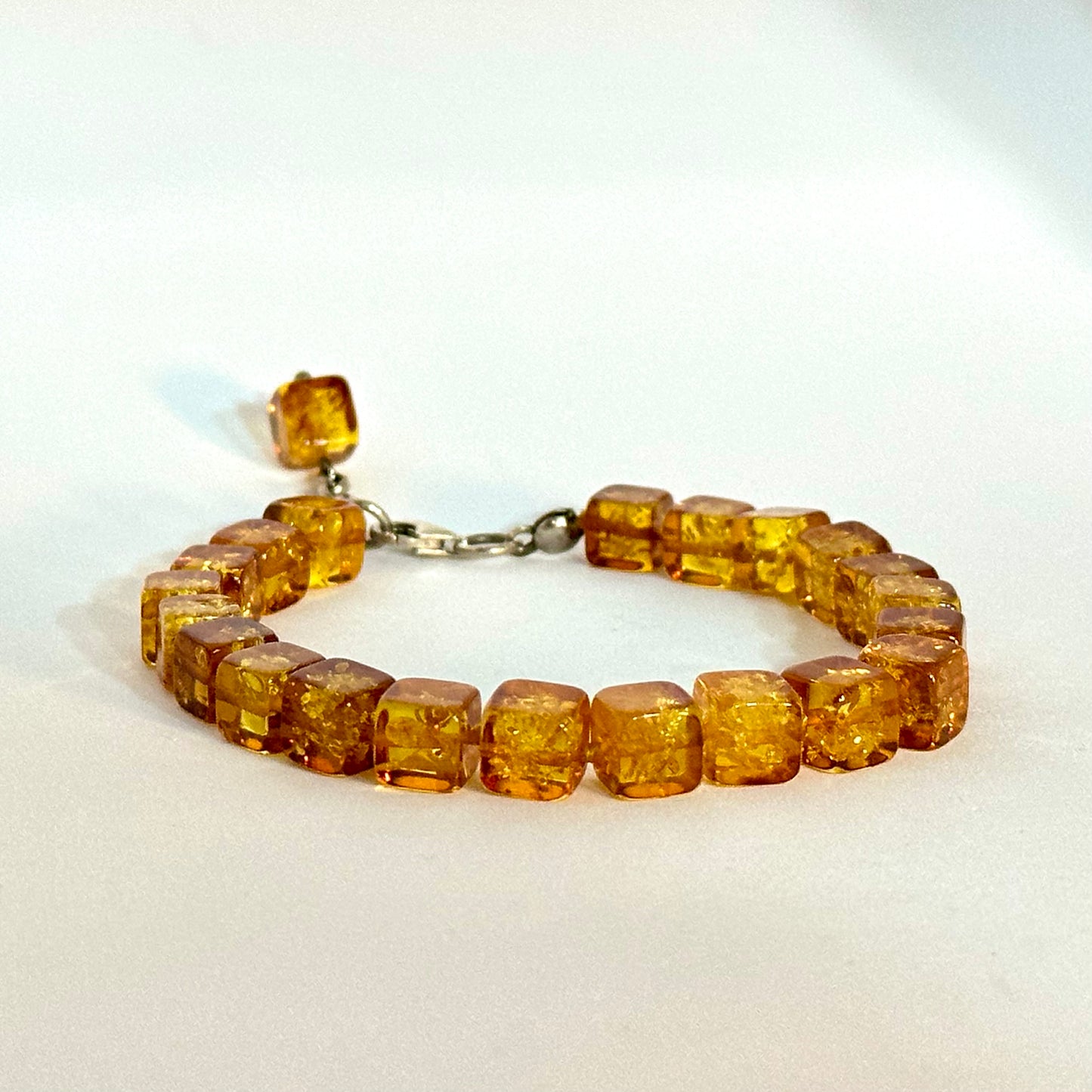 Playful square amber bracelet