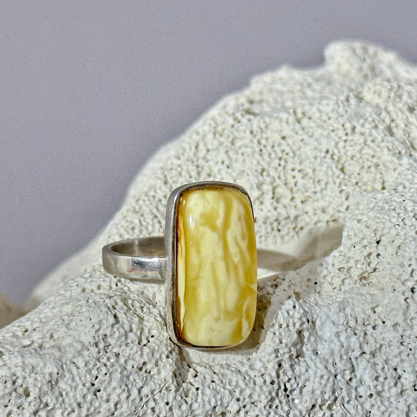 White marble-like amber ring