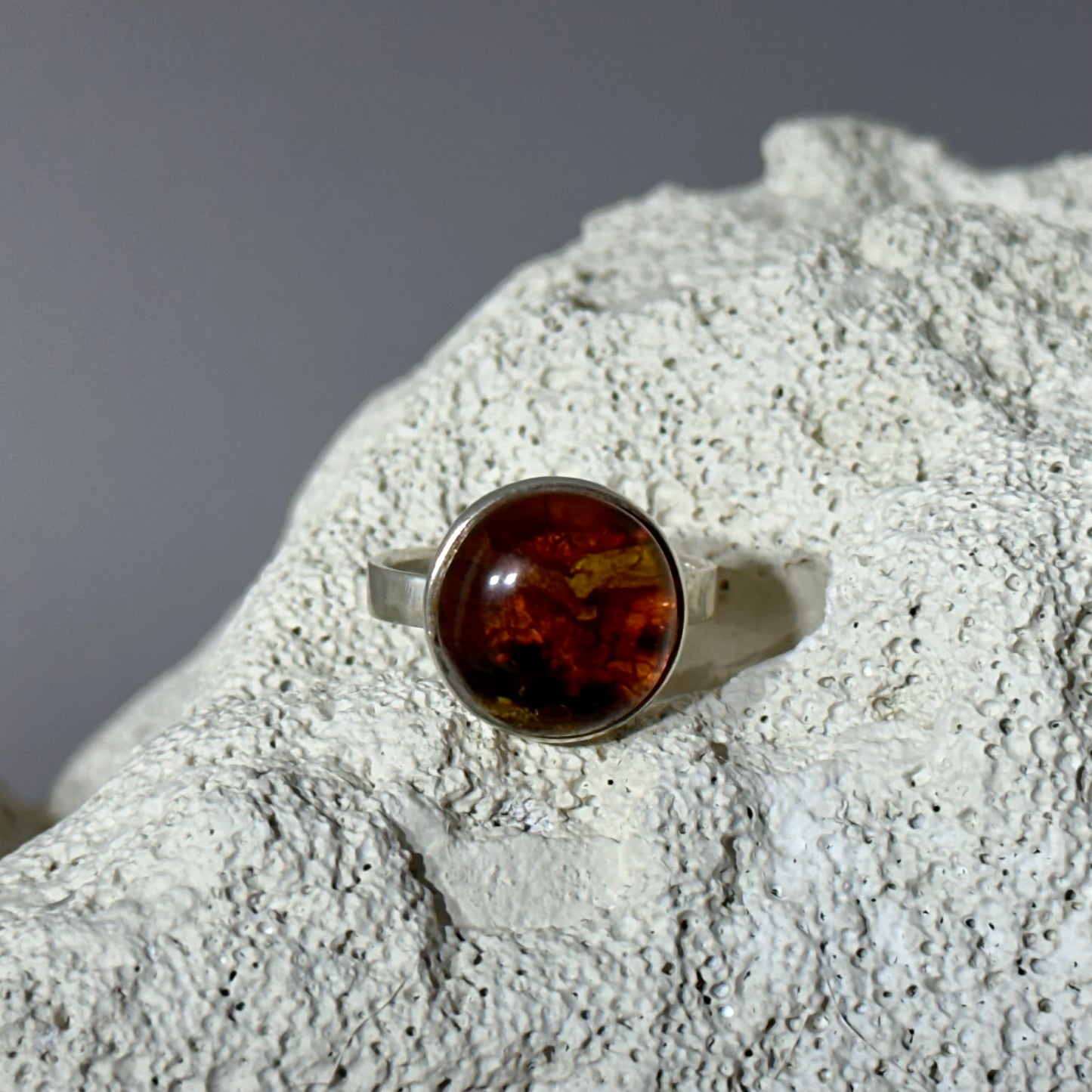 Cognac amber ring with unique inlay