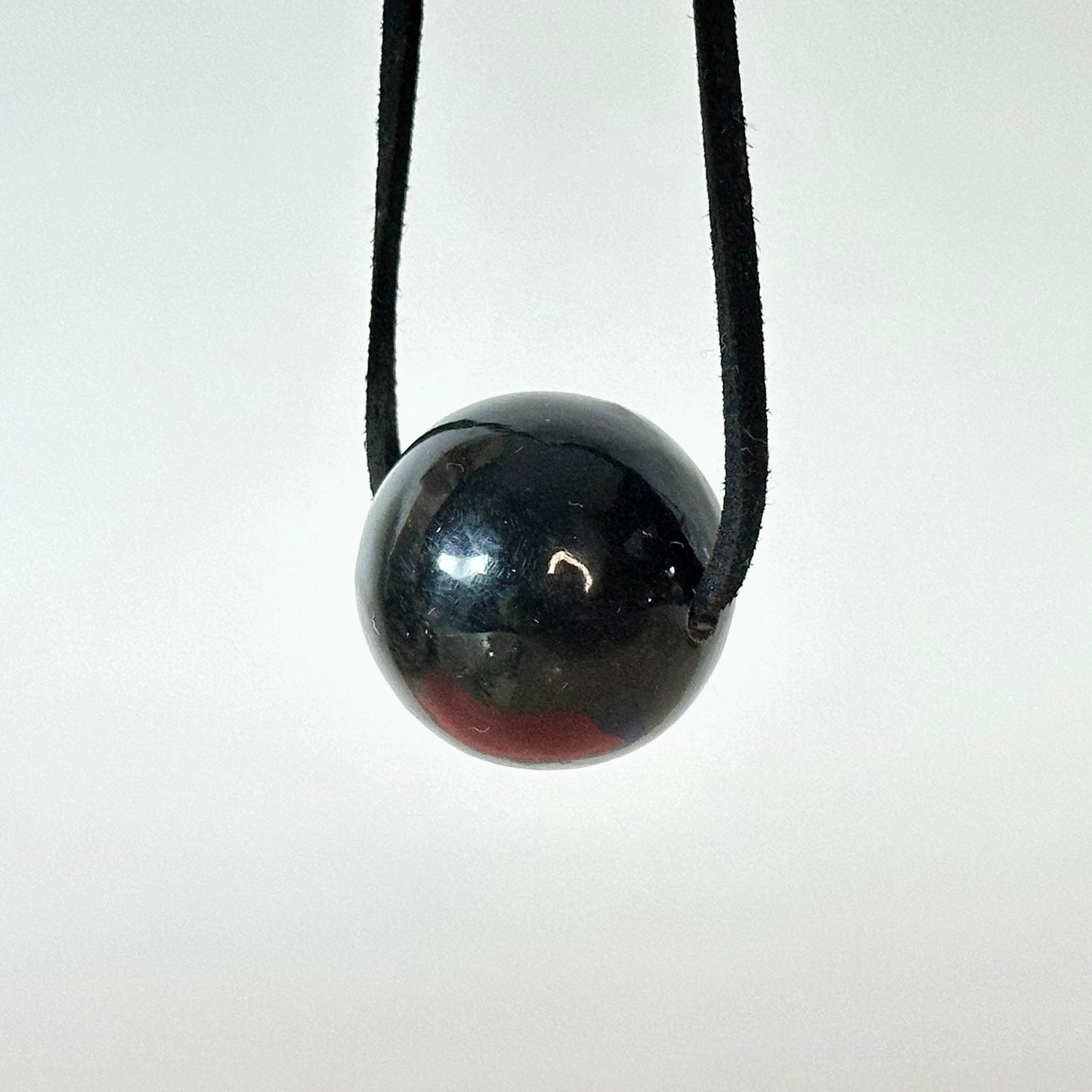 Versatile round amber pendant