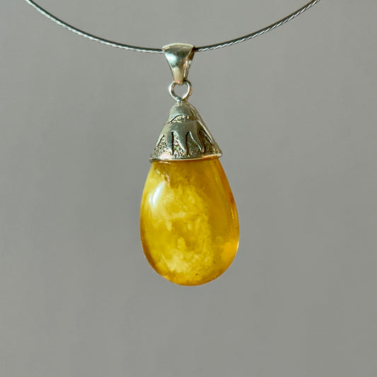 Sunburst-inspired amber pendant