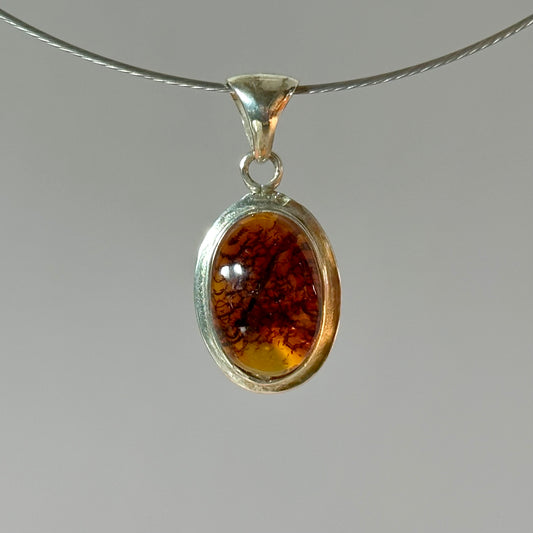 Timeless oval amber pendant