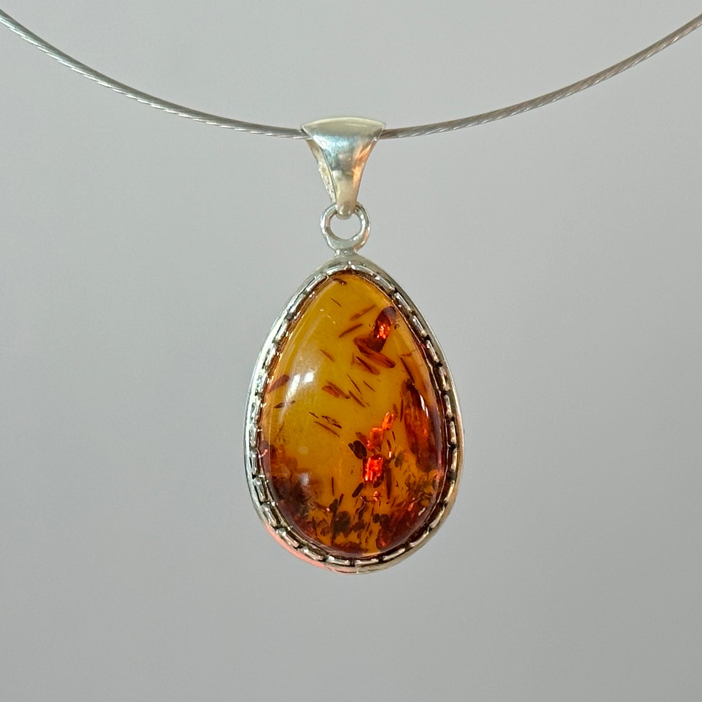 Fiery brown amber pendant