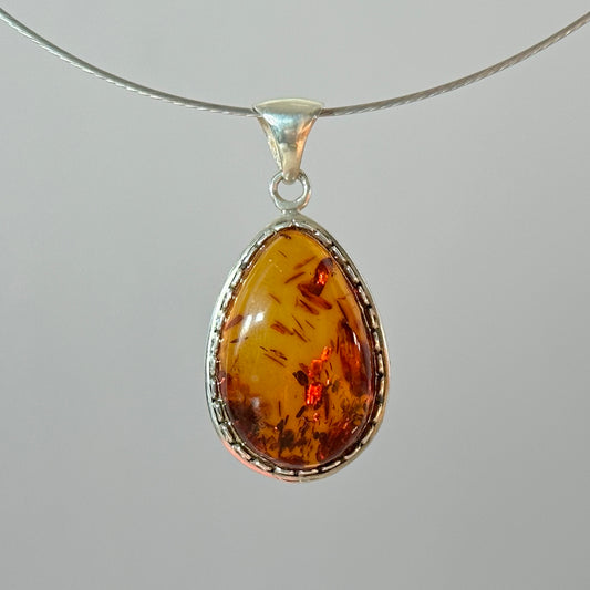 Fiery brown amber pendant