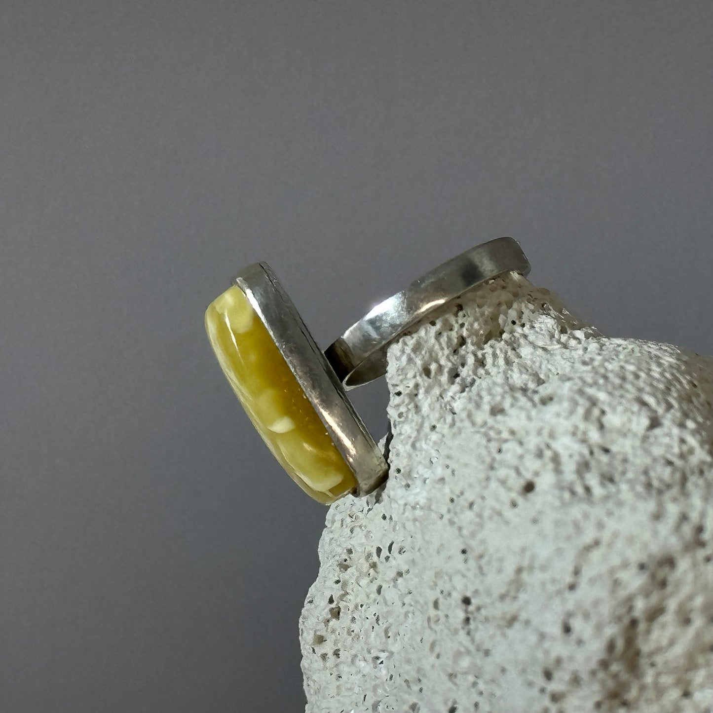 White marble-like amber ring